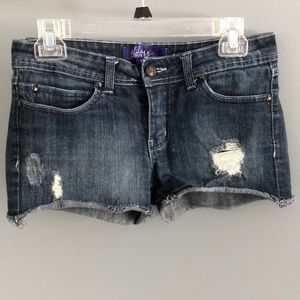 Distressed denim Miley Cyrus shorts.